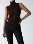 FJØRNA sleeveless wool vest for women, stylish and warm top, shown in a close-up with soft knit fabric detail.