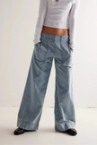 FJØRNA women's wide-leg denim jeans displaying relaxed fit, high waist, and classic blue denim fabric.