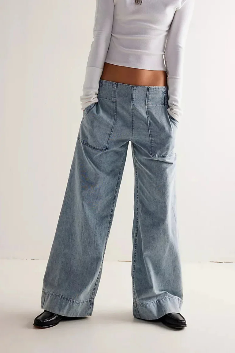 FJØRNA women's wide-leg denim jeans displaying relaxed fit, high waist, and classic blue denim fabric.