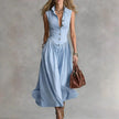 FJØRNA Martina elegant flowy midi dress in soft fabric with a fitted waist and flowing skirt, perfect for formal occasions.