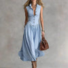 FJØRNA Martina elegant flowy midi dress in soft fabric with a fitted waist and flowing skirt, perfect for formal occasions.