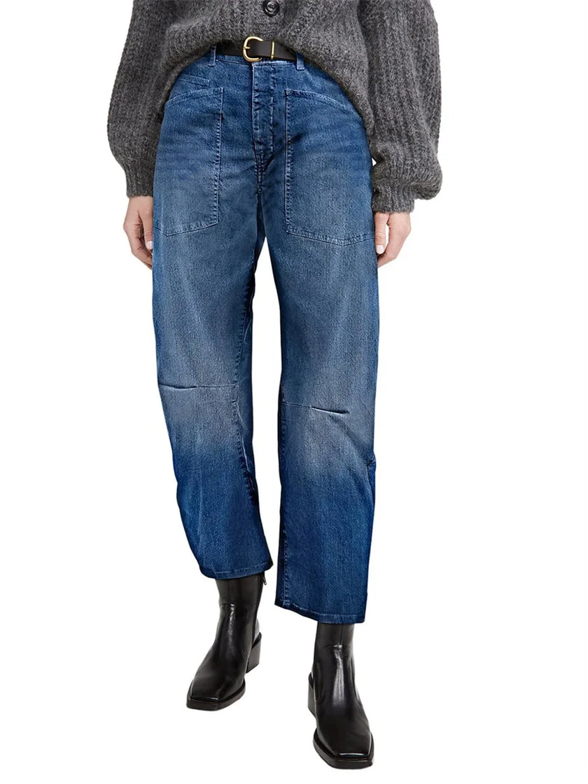 FJØRNA women's denim jeans with a stylish barrel leg cut, showcasing classic blue denim and a relaxed fit.