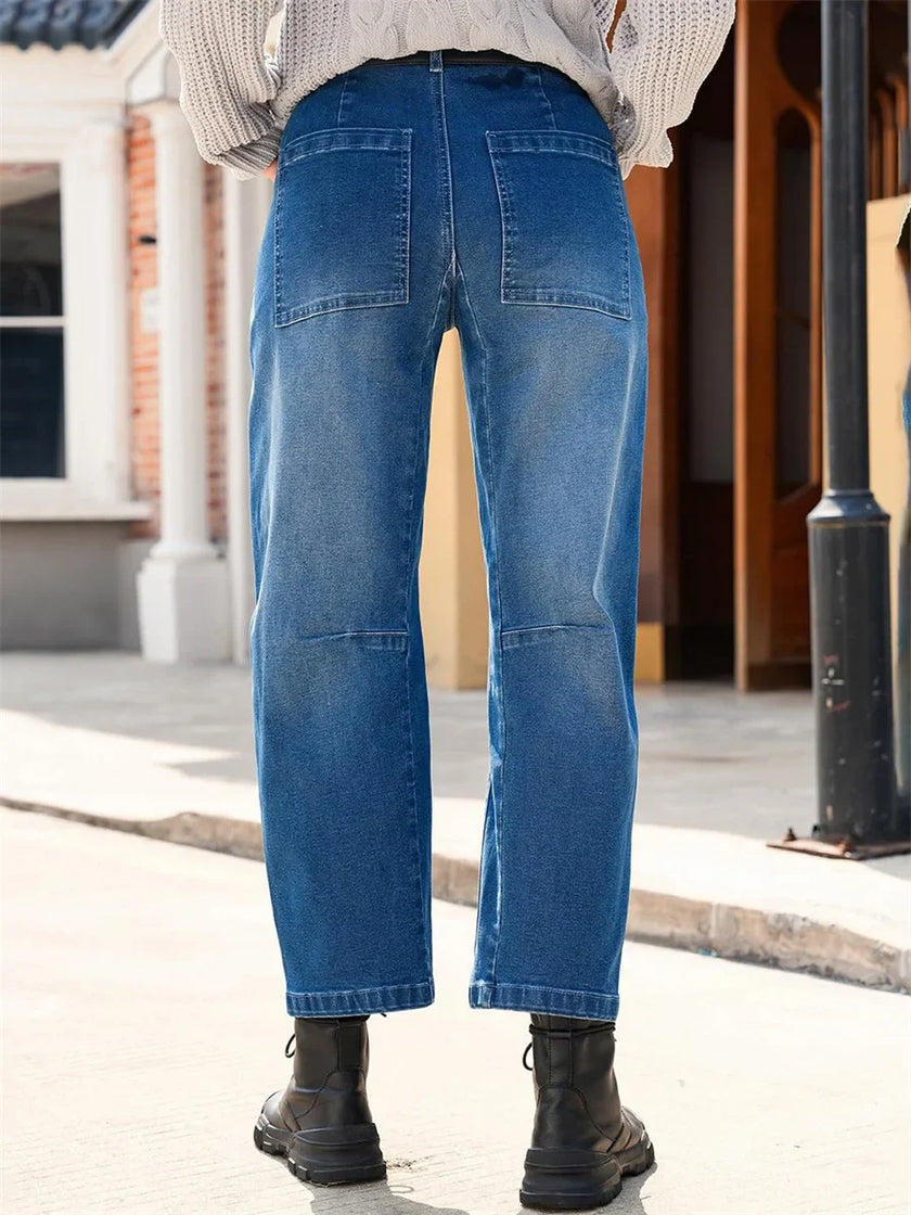 Women’s FJØRNA denim jeans with a classic barrel leg style, showcasing a casual fit and durable denim fabric.