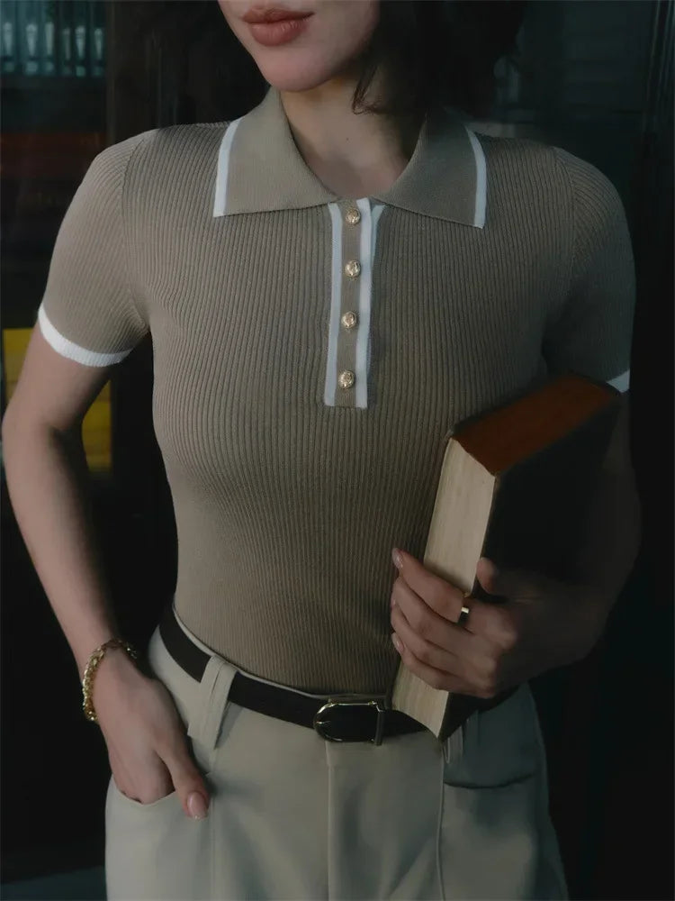 FJØRNA women's cotton polo top featuring a classic collar and short sleeves, styled on a model.