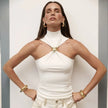 Silk halter neck top for women by FJØRNA, elegant sleeveless blouse with smooth fabric and stylish neckline.