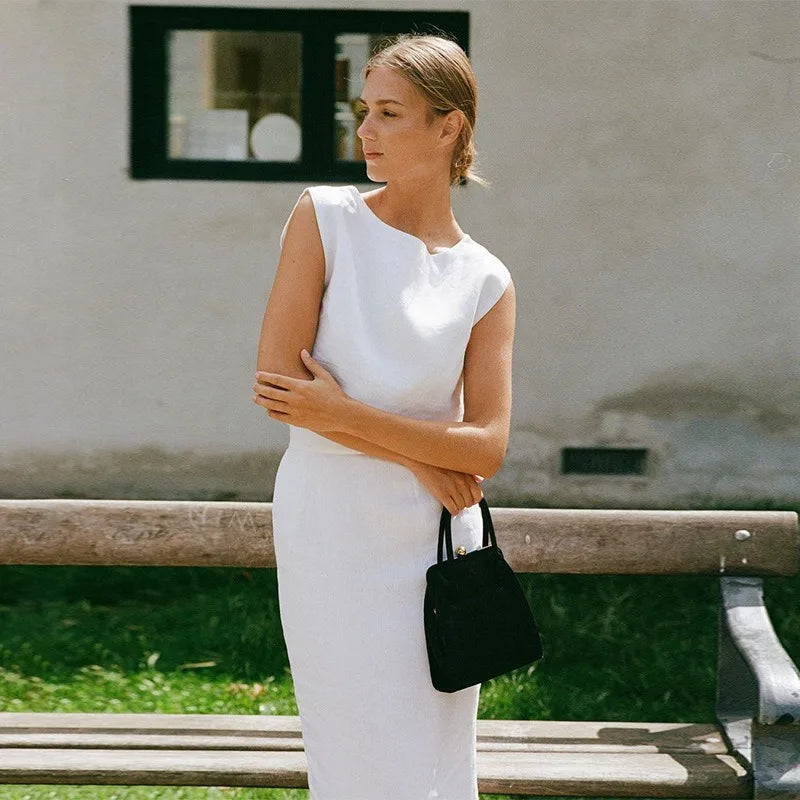 FJØRNA women's linen crop top featuring a lightweight, breathable fabric and a stylish cropped design perfect for warm weather.