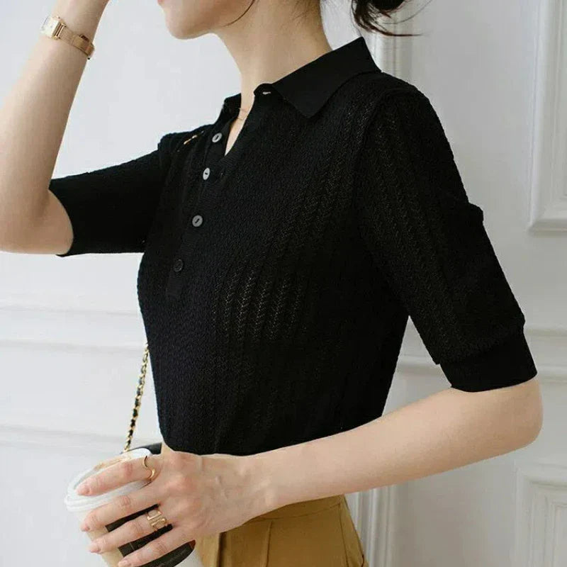 FJØRNA women's ribbed knit polo blouse, close-up of the fitted, ribbed fabric and classic collar on a stylish top.