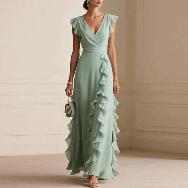 FJØRNA Patricia ruffle trim white maxi dress with flowing fabric and elegant design, perfect for summer or special occasions.