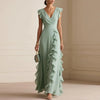 FJØRNA Patricia ruffle trim white maxi dress with flowing fabric and elegant design, perfect for summer or special occasions.