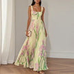 Elegant floral maxi dress for women by FJØRNA, featuring an A-line silhouette and flowing fabric, perfect for stylish occasions.