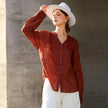 Women’s linen V-neck shirt by FJØRNA featuring a relaxed fit, lightweight fabric, and classic V-neck design.