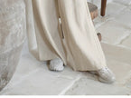 FJØRNA women's linen wide-leg trousers with elastic waist and ruffle detail, casual and comfortable pants for women.