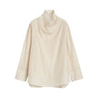 FJØRNA women's linen top with short sleeves and relaxed fit, soft and breathable fabric in a light neutral color.