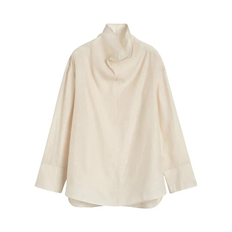 FJØRNA women's linen top with short sleeves and relaxed fit, soft and breathable fabric in a light neutral color.