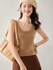 Soft beige FJØRNA women's cashmere top with long sleeves, lightweight and cozy for stylish winter wear.