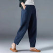 FJØRNA Desiree™ lightweight summer trousers shown in beige, with a relaxed fit and breathable fabric for warm weather.