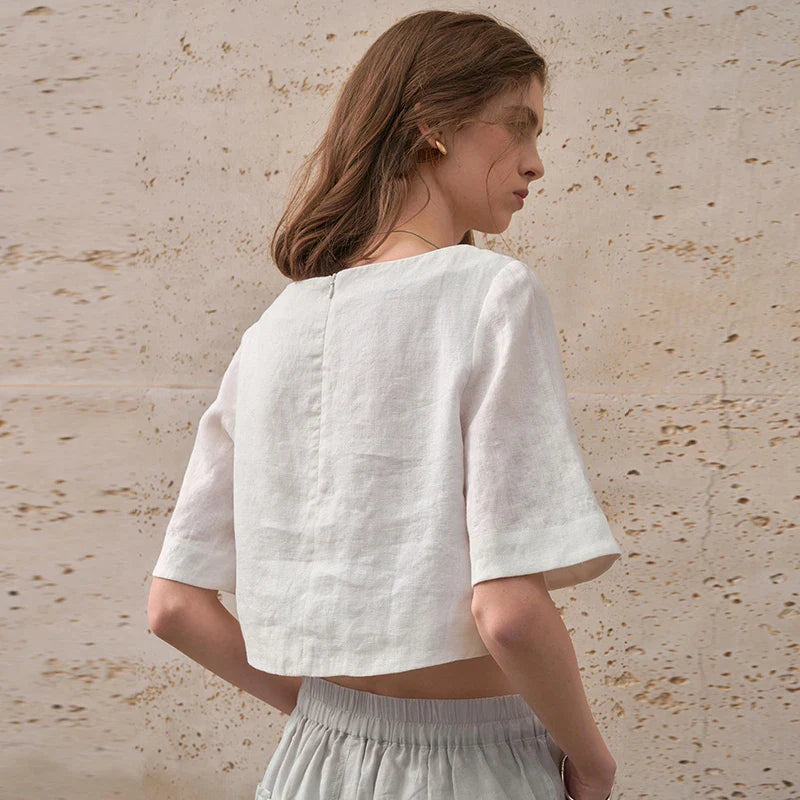 FJØRNA women's linen crop top with short sleeves, lightweight and breathable for casual summer wear.