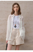 FJØRNA women's linen shirt, stylish and breathable top with long sleeves, lightweight fabric, and classic collar detail.