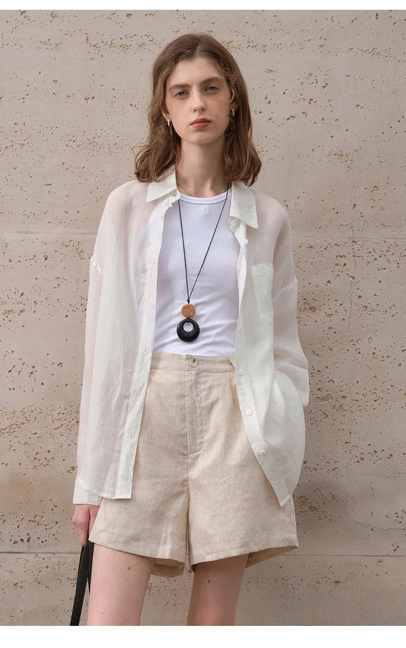 FJØRNA women's linen shirt, stylish and breathable top with long sleeves, lightweight fabric, and classic collar detail.