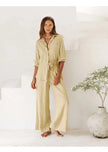Extra-large linen shirt by FJØRNA with spacious pockets, shown in a natural fabric texture and relaxed fit on a model.
