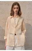 FJØRNA women's linen shirt, lightweight and breathable women's top, featuring a relaxed fit and natural fabric texture.