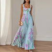FJØRNA elegant floral maxi dress for women, A-line style with a flowing silhouette and vibrant floral pattern.
