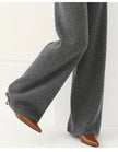 Women’s Merino wool joggers by FJØRNA with wide-leg design, soft knit fabric, and comfortable fit in natural wool material.