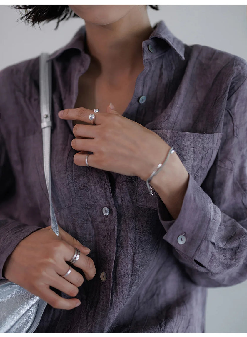 FJØRNA women's linen shirt with pleated design, featuring a relaxed fit and lightweight fabric, perfect for casual or summer wear.