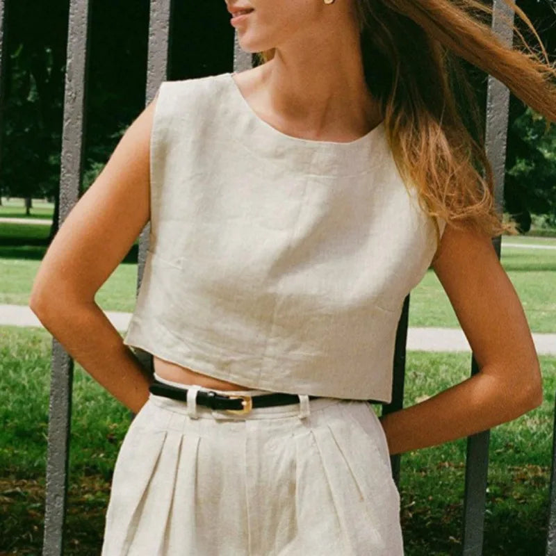 FJØRNA women's linen crop top with short sleeves and V-neck, lightweight and breathable for casual summer wear.
