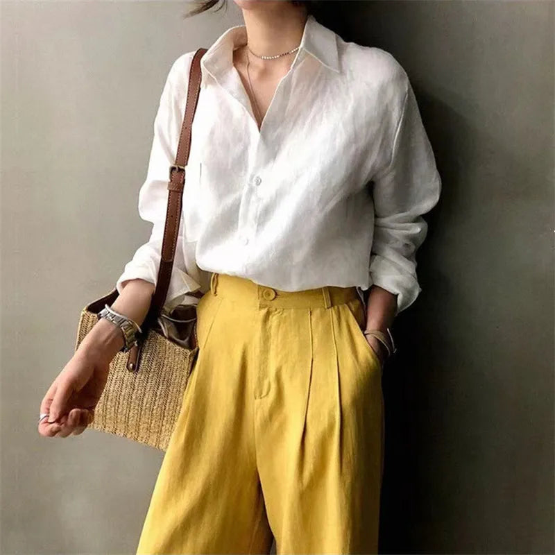 FJØRNA women's linen shirt with open collar, casual top featuring lightweight, breathable fabric for relaxed summer style.
