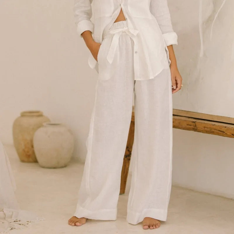Women's linen top with ruffle details by FJØRNA, showcasing a lightweight, stylish blouse with feminine accents.