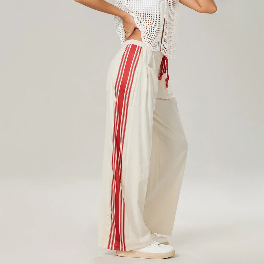 Women’s high waist cotton joggers by FJØRNA with elastic waistband, shown in a casual, relaxed fit style.