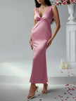 FJØRNA elegant sleeveless V-neck empire waist midi dress displayed on a hanger with flowing fabric