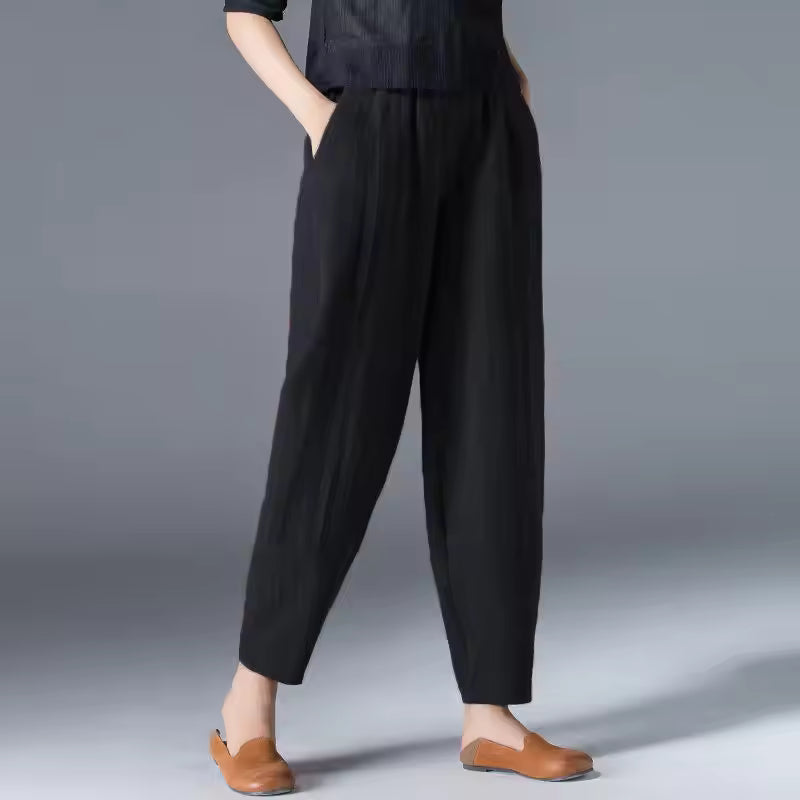 FJØRNA Desiree™ lightweight summer trousers in soft fabric, shown in a relaxed fit with a casual waistband and side pockets.