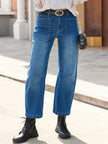 FJØRNA women's denim jeans with a barrel leg fit, showcasing classic blue denim and relaxed, stylish design.
