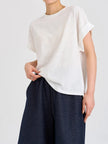 FJØRNA oversized tee with rolled cuffs, soft fabric, relaxed fit, and casual style, shown on a model.