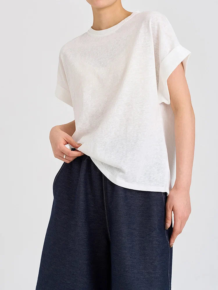 FJØRNA oversized tee with rolled cuffs, soft fabric, relaxed fit, and casual style, shown on a model.