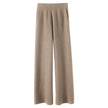 FJØRNA women's joggers, comfortable pants with a relaxed fit and elastic waistband, shown in a casual outdoor setting