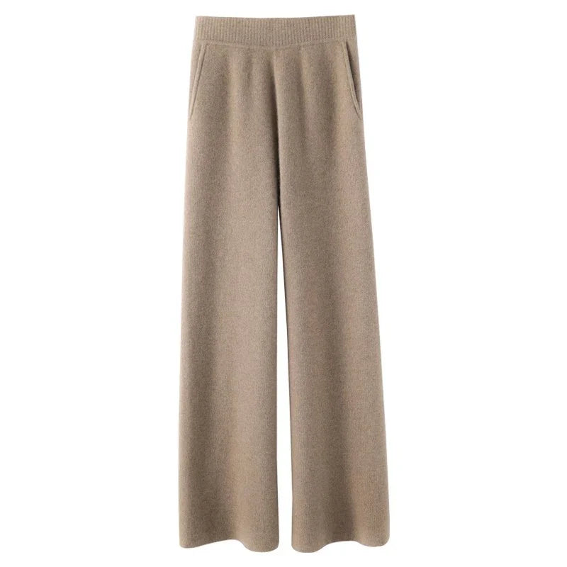 FJØRNA women's joggers, comfortable pants with a relaxed fit and elastic waistband, shown in a casual outdoor setting
