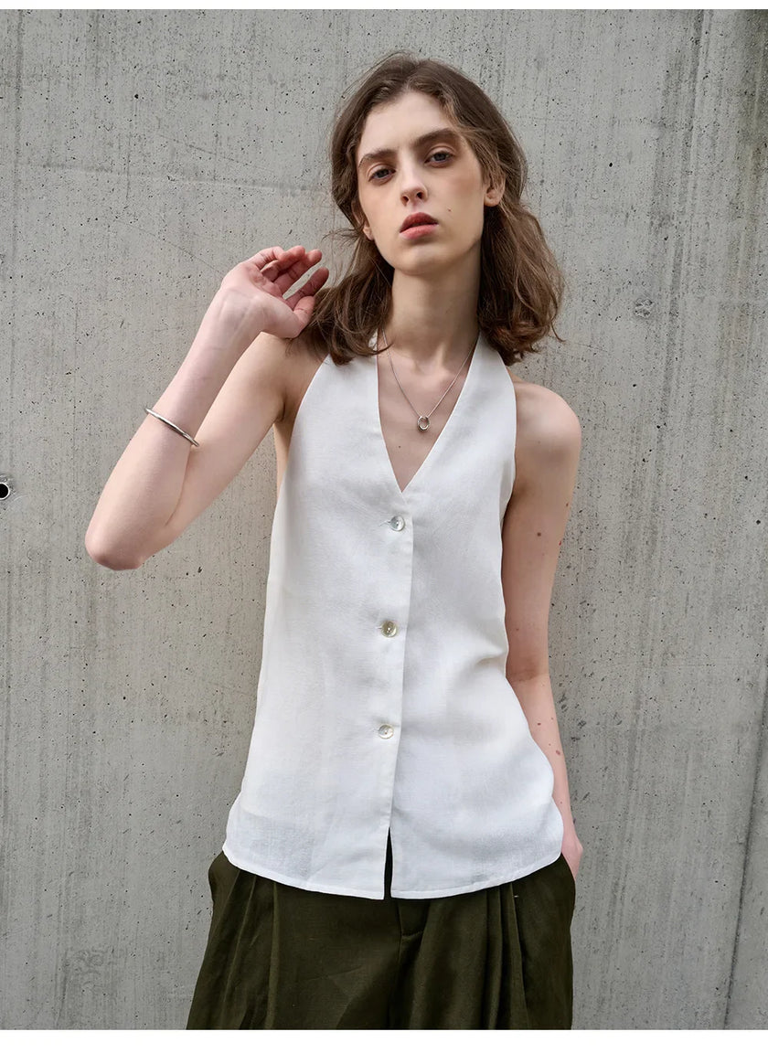 Linen waistcoat for women by FJØRNA, sleeveless halter neck top, stylish and lightweight for warm weather wear.