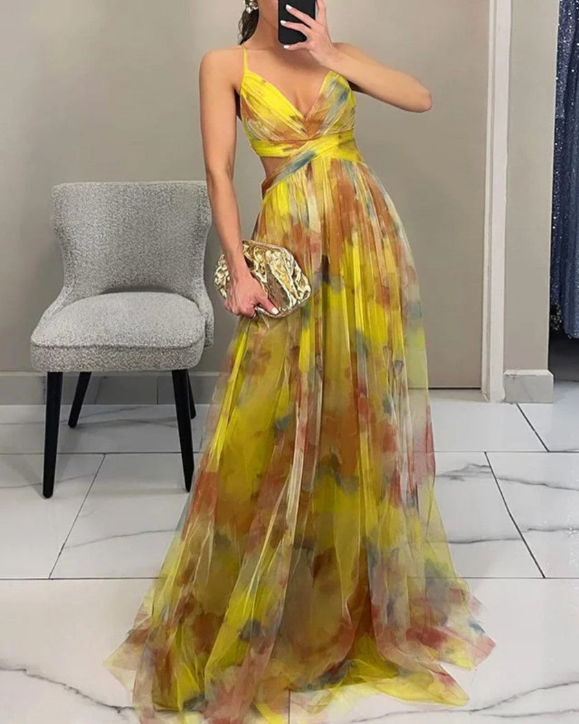 Elegant floral V-neck maxi dress for women by FJØRNA, featuring a flowing silhouette and intricate floral pattern.