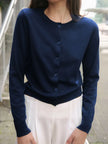 Women’s knit cardigan by FJØRNA featuring a cozy, textured design perfect for casual or layered outfits.