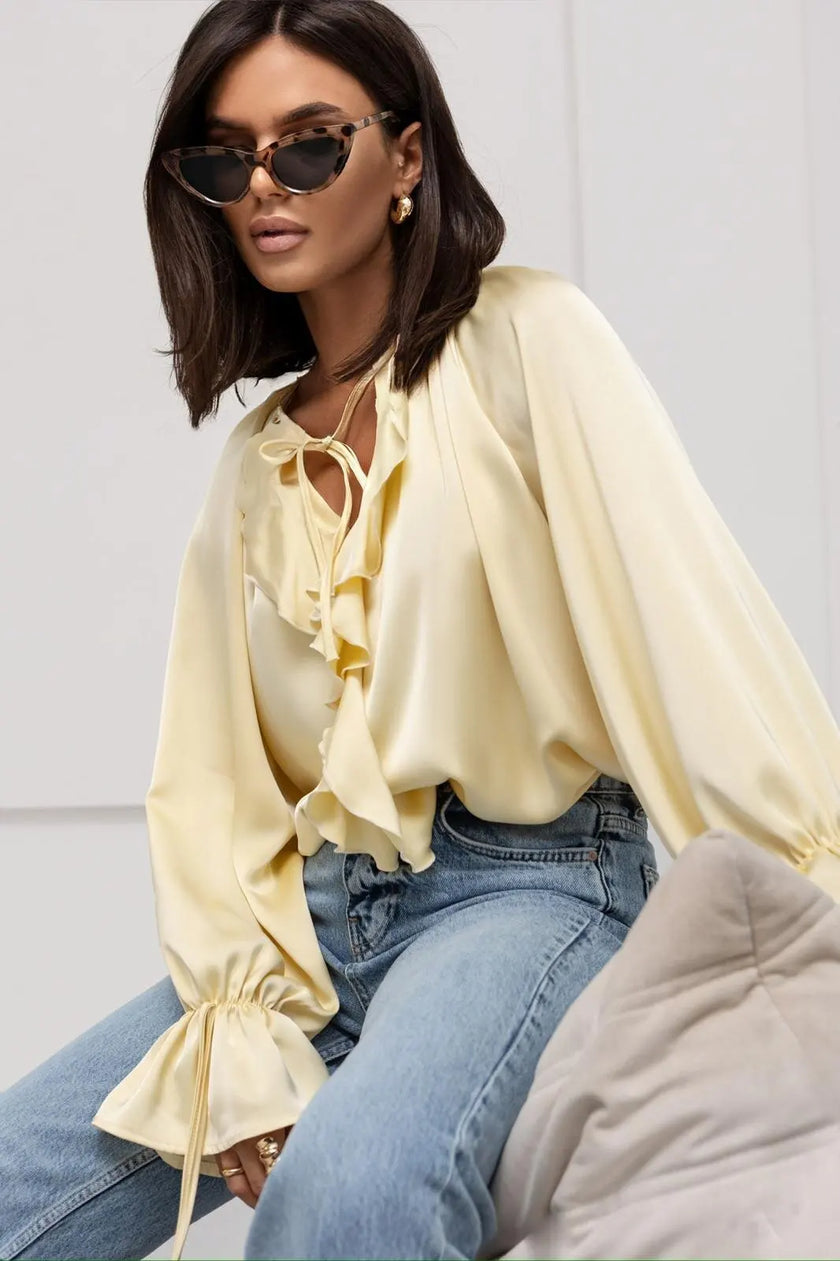 FJØRNA satin women's blouse with ruffle detail, elegant tops for women, showcasing soft fabric and stylish design.