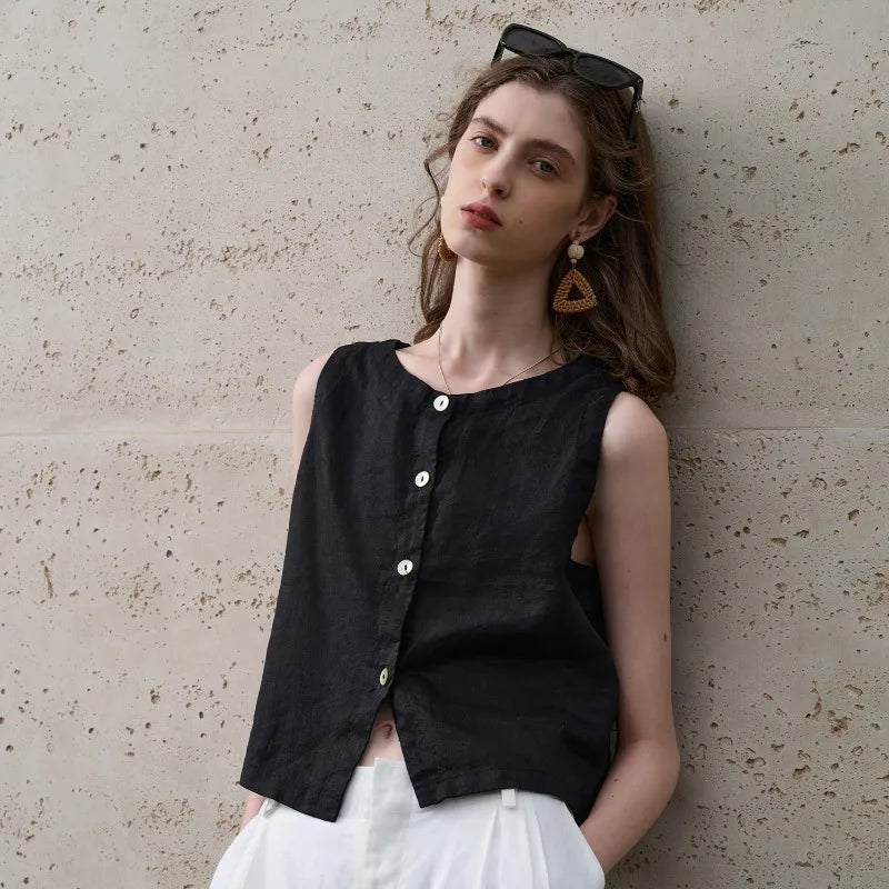 FJØRNA linen crop top for women, sleeveless and lightweight, features a relaxed fit and natural fabric texture.