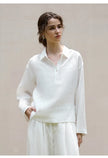 FJØRNA women's linen polo top with collar, lightweight and breathable, shown in a natural beige color.