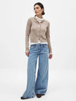 FJØRNA women's knit cardigan featuring long sleeves and a cozy, textured design, perfect for casual or layered outfits.