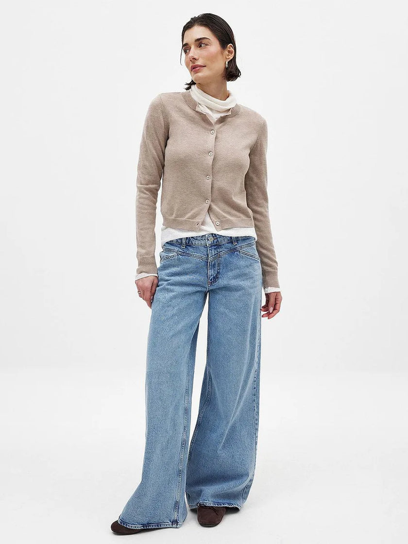 FJØRNA women's knit cardigan featuring long sleeves and a cozy, textured design, perfect for casual or layered outfits.