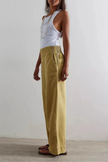 FJØRNA women's wide-leg denim jeans showing classic blue denim fabric and relaxed fit, full-length pants with a high waist.