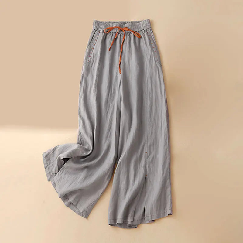 FJØRNA linen wide-leg women's trousers with drawstring waist, lightweight and comfortable for casual wear.