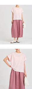 FJØRNA oversized tee with rolled cuffs, featuring a relaxed fit and casual style, shown in a front view.